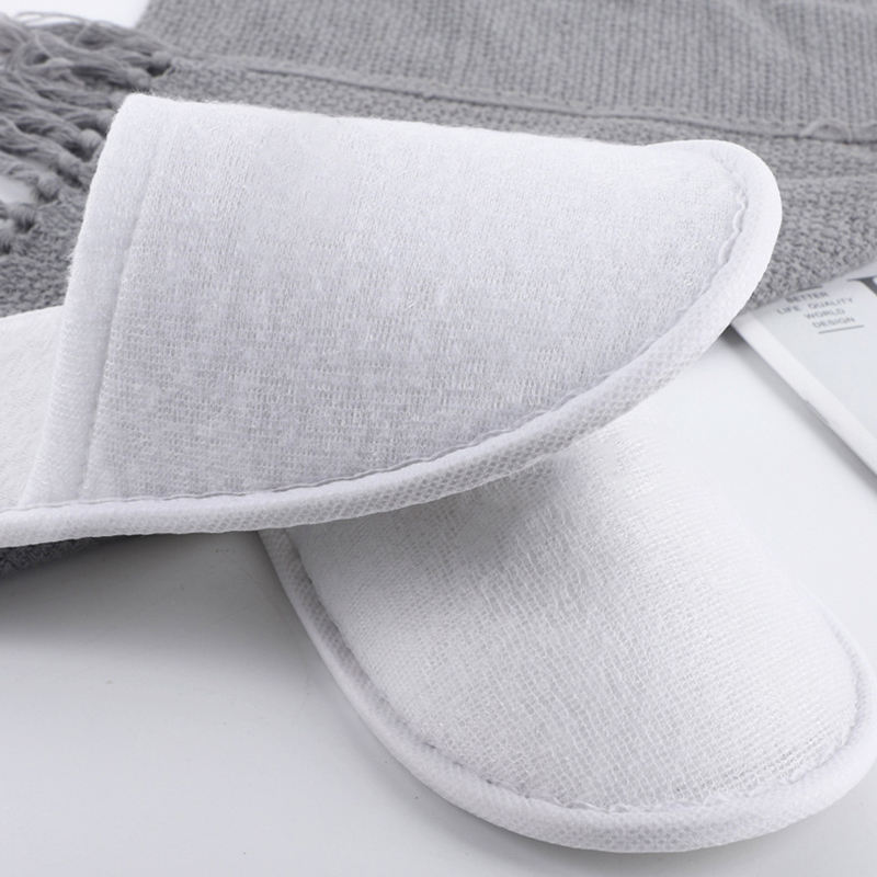 Latest Cheap Personalized Hotel Spa Disposable slippers Men and Women Wholesale Eco Degradable Dipos slippers Manufacturer product view