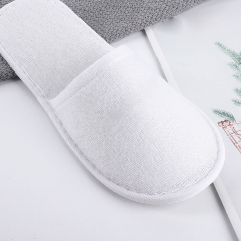 Latest Cheap Personalized Hotel Spa Disposable slippers Men and Women Wholesale Eco Degradable Dipos slippers Manufacturer product view