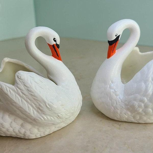 A Pair Of Ceramic Artwork Love Swans/Candle Holders