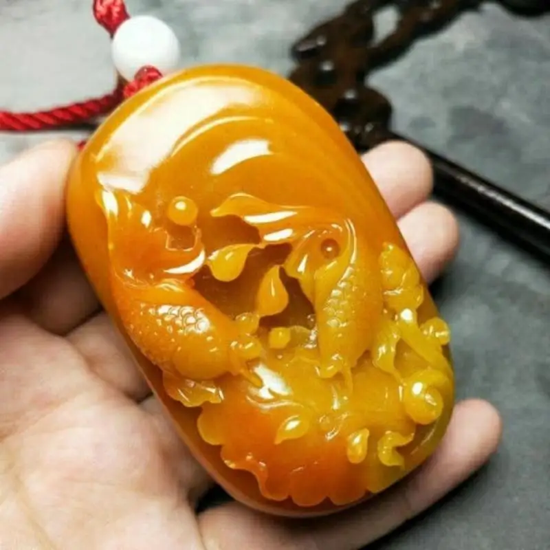 Antique Huanglong Jade Pendant: Delicate Goldfish Swimming Design