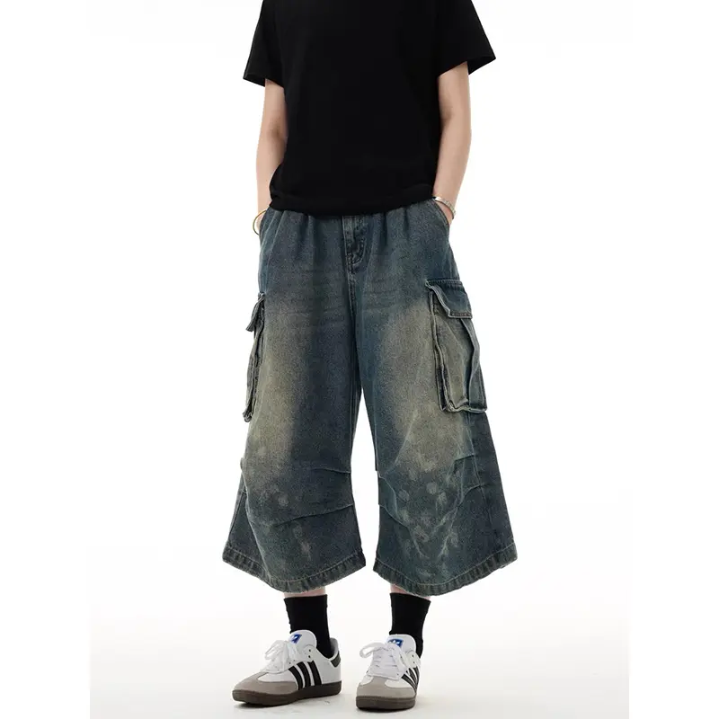 Men's Denim Shorts With Washed Finish, Multiple Pockets, And A Loose, Flowing Style.